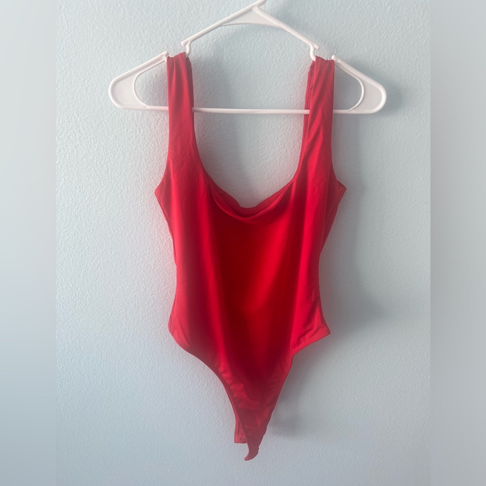 Brand new silky bodysuit. It didn’t fit me. My torso is too long 😅